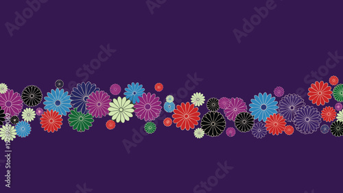 Vibrant pattern of stylized chrysanthemum flowers in various colors like red purple and blue on a deep purple background for textiles.