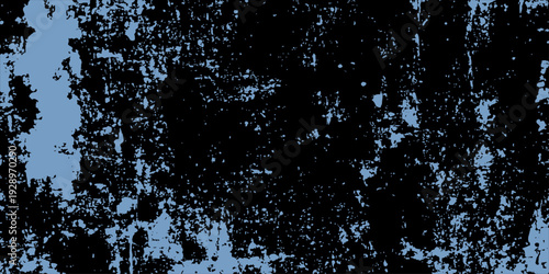 A wet splash of liquid water drops from a blue fountain creates a frozen nature texture against a dark winter sky pattern with cold ice bubbles