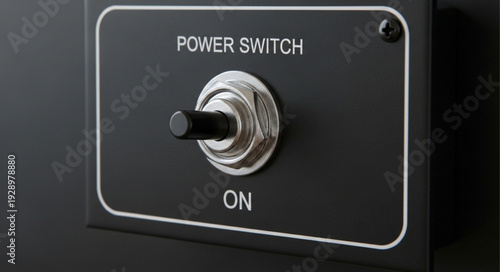 Close-up of a power switch in the on position, ready to activate.