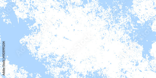 A vintage blue grunge abstract background features a cold winter texture with a snowy pattern and painted light effects on an old textured paper wall design