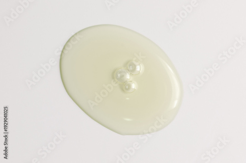 Transparent cosmetic product. Face serum or cleanser gel or body moisturizing gel.