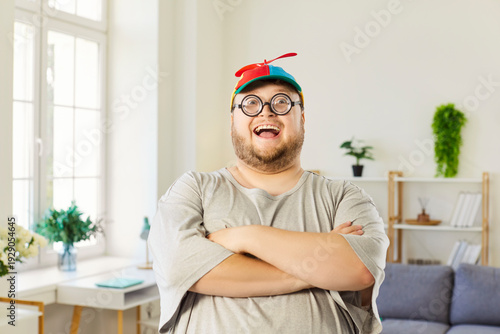 Fotografie Funny chubby man in beanie and glasses