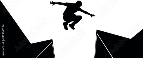 Silhouette of a person jumping between two black cliffs