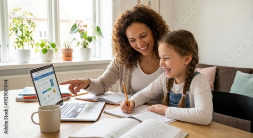 Happy adult woman and young girl studying together, the woman pointing at a laptop screen while the girl writes in a notebook, fostering a warm and supportive learning environment at home