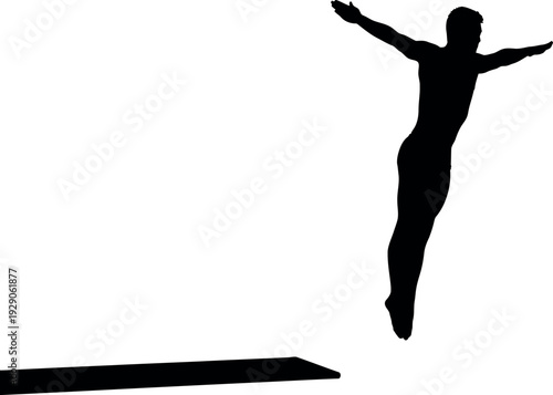 Silhouette of a person jumping off a cliff in a dynamic pose