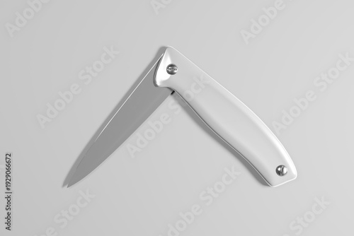 Konstfotografi A silver folding knife with a sharp blade and smooth handle