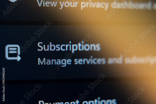 Close-up of Subscriptions menu on a digital screen with Manage services and subscriptions text, concept for online account management and recurring billing services