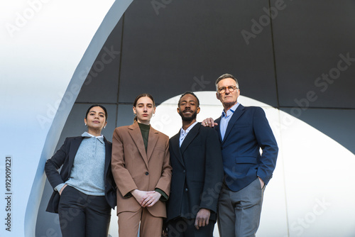 Confident business professionals in formal wear standing in Barcelona