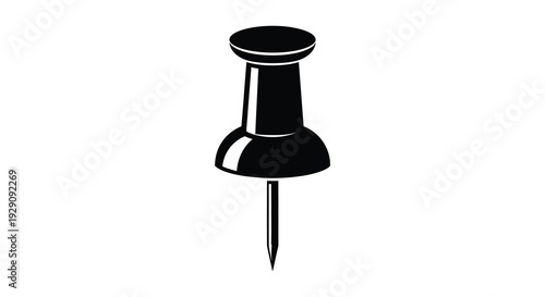A stark black silhouette of a classic push pin against a bright white background emphasizing simplicity and form silhouette