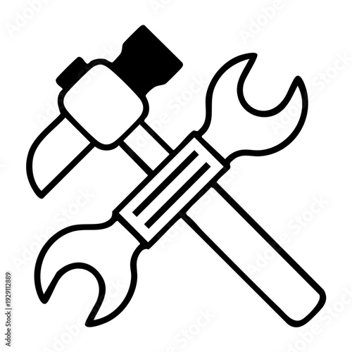 A simple black and white illustration of a hammer and wrench crossed over each other, representing tools and hardware used in construction, repair, and maintenance. 
