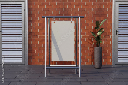 Foto A blank white sign on a metal stand in front of a red brick wall with two gray d