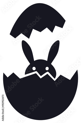 Black silhouette of a bunny peeking out of a cracked Easter egg