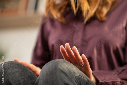 Woman practicing alternating leg tapping as part of EMDR self-regulation. Emphasizes bilateral rhythm, posture stability, and therapeutic focus.