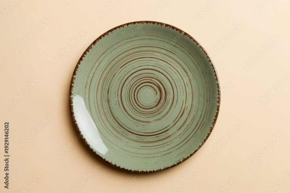 Fototapeta premium Top view of isolated of colored background empty round green plate for food. Empty dish with space for your design