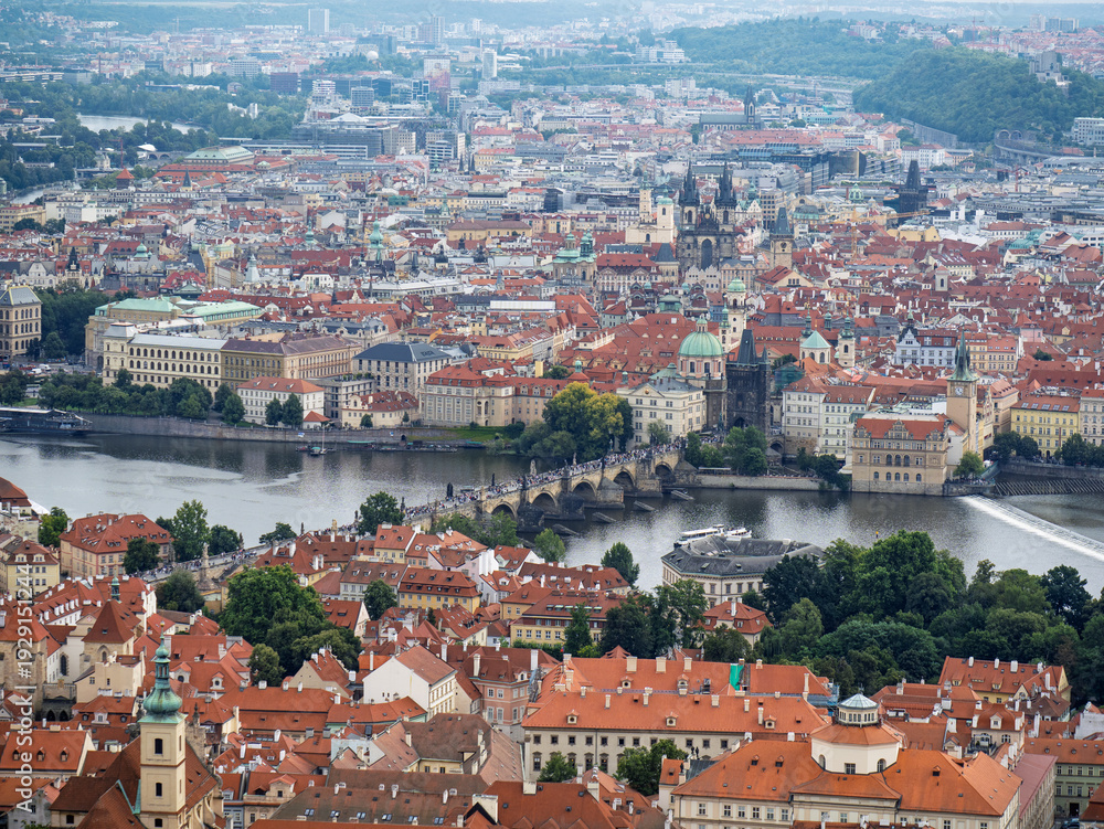 Obraz premium High Angle View Of Charles Bridge Crossing The Vltava River Among Historic City Center Buildings, Prague, Czech Republic