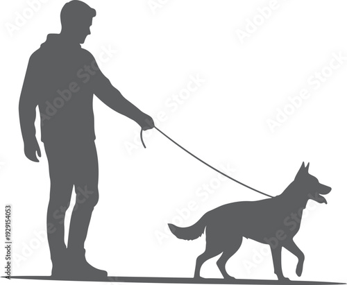 A silhouette of a man walking his dog on a leash during the evening