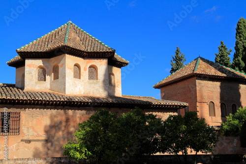 Alhambra Courtyard With Ornate Moorish Arches and Tower