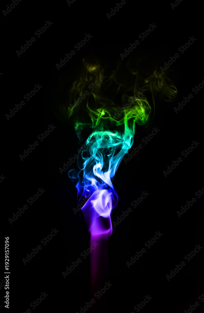 Fototapeta premium A delicate wisp of multicoloured smoke curling gracefully against a deep black background, creating an ethereal and minimalist atmosphere