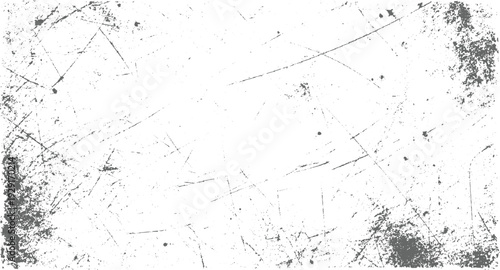 White surface with numerous grey scratches and speckles creating a distressed texture background