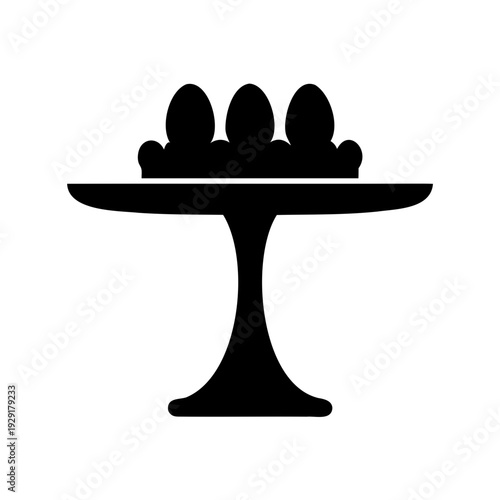 Black silhouette of a pedestal cake stand with decorated Easter eggs