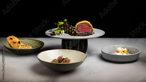 Bild auf Leinwand A mix of gourmet fusion fine dining dishes, including beef wellington, steak tar