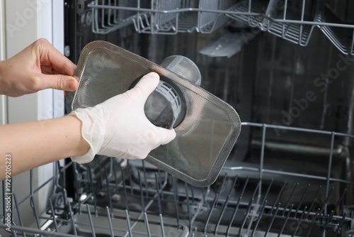 Dishwasher filter maintenance. washing the dishwasher filter.High quality 4k footage
