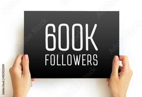 Wallpaper Mural 600K Followers text on card held by hands. Minimal milestone banner for social media growth celebration, influencer achievement, audience reach, marketing or online community Torontodigital.ca