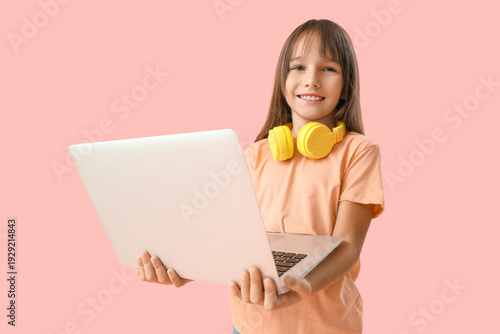 Cute little schoolgirl with...