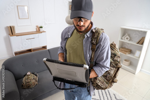 Young soldier working with ...