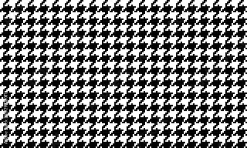 Seamless houndstooth fabric pattern, black and white, classic and elegant design, suitable for backgrounds or clothing patterns, communicating modernity and uniqueness.