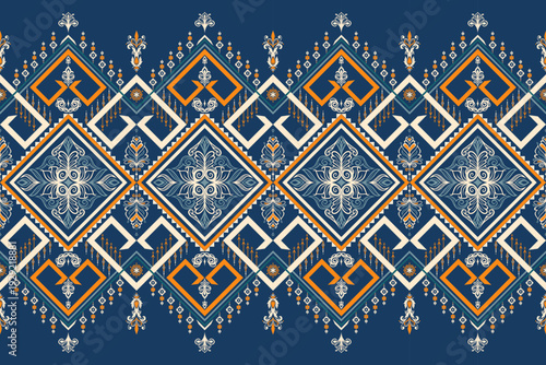 Ornamental diamond seamless pattern in navy, orange and cream. Suitable for upholstery, wallpaper, textile printing, fashion fabric and home decor production.
