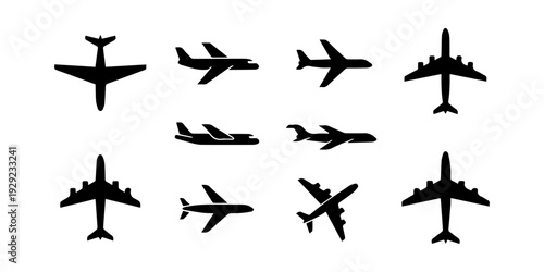 Collection of various airplane silhouettes arranged on a plain white background silhouette