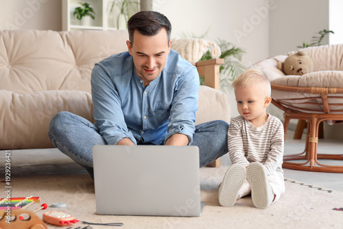 Father and little son watch...