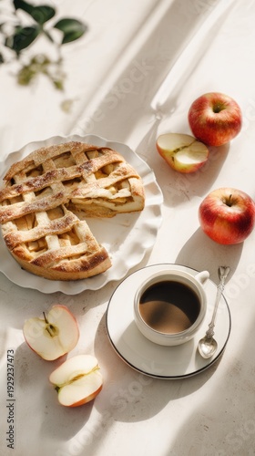 Fresh apple pie slice with coffee and apples in bright sunlight