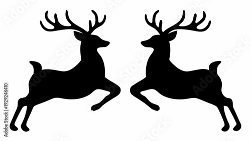 Two majestic deer in mid-leap with impressive antlers
