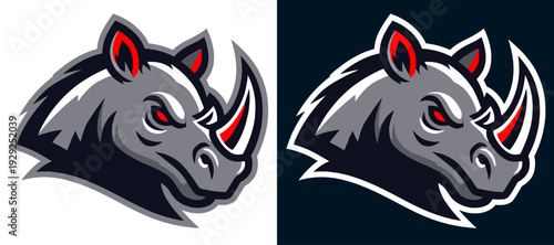 A powerful rhino, its formidable horn and intense gaze conveying raw strength and determination, embodies the spirit of resilience and untamed wilderness.