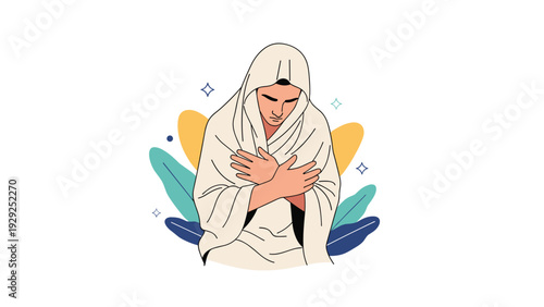 Man sitting with his arms crossed and wrapped in a thick white towel or blanket against a decorative leaf background after a shower.