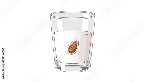 Glass of almond milk with an almond inside