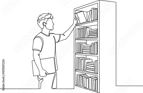 Young student reaching for a book on a library shelf for academic research education and literary study