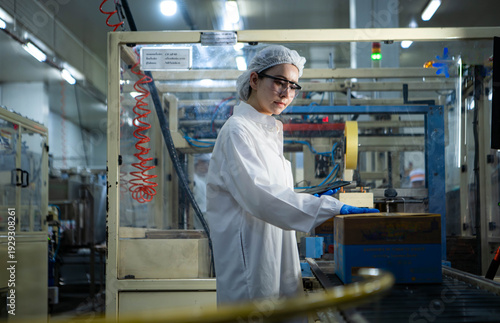 Wallpaper Mural Food scientist inspecting canned fish production line Torontodigital.ca