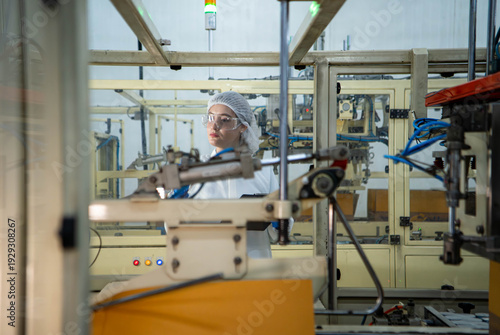 Wallpaper Mural Food scientist inspecting canned fish production line Torontodigital.ca