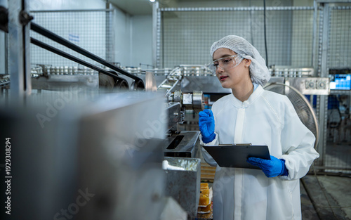 Wallpaper Mural Food scientist inspecting canned fish production line Torontodigital.ca
