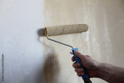 The painter repaints the wall. Painting works