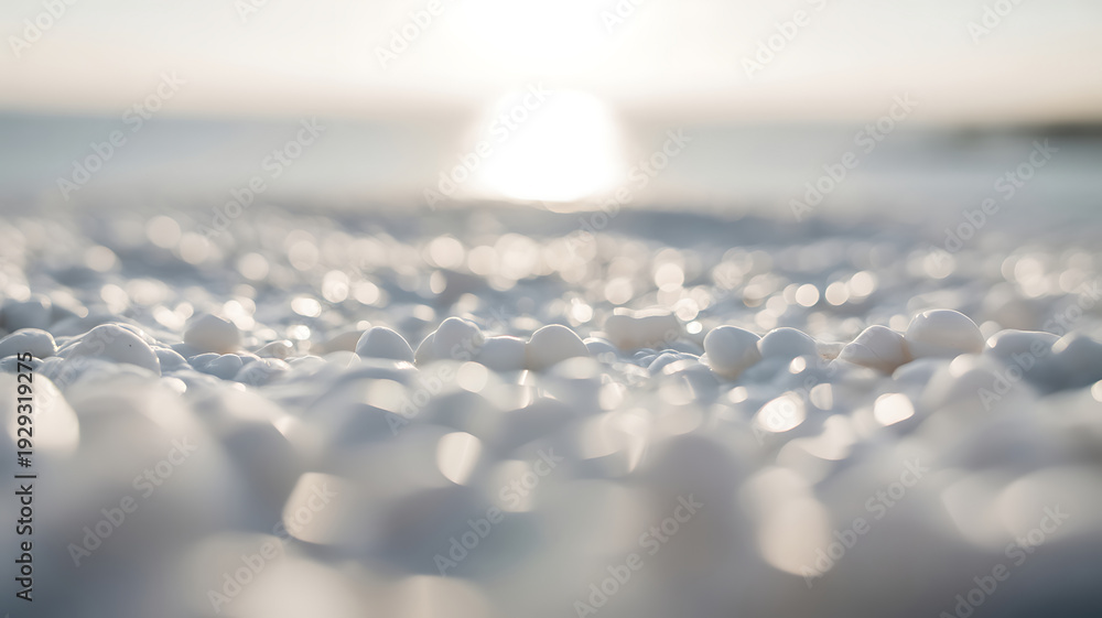 Obraz premium Extreme close-up of smooth, white, pebble-like textures with soft, glowing bokeh highlights under bright sunlight.