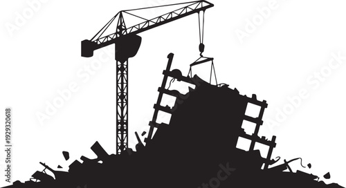 Black silhouette of crane demolishing building demolition