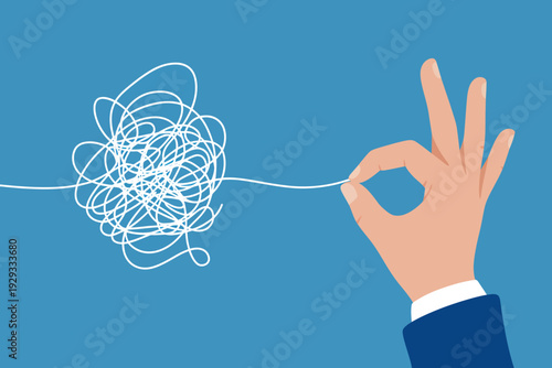 Hand holding thread unknotting tangled mess