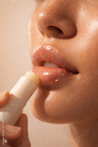 Woman Applying Lip Balm Close Up
