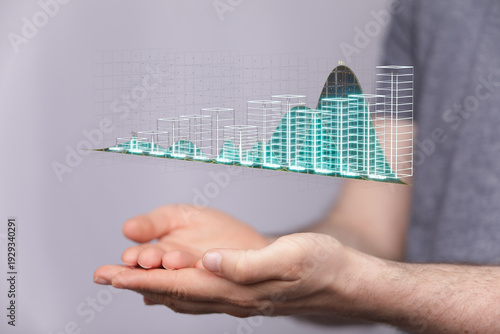 Person holding digital grap...