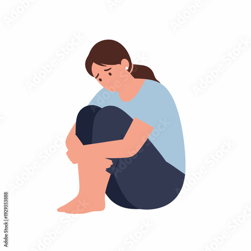 Sad teenage girl sitting on floor distressed and emotional.