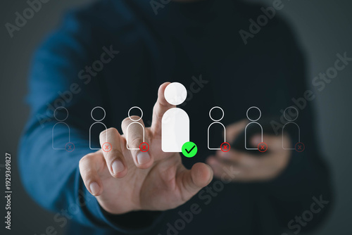 Human resources selection concept with choosing the right candidate from group. Hand touching virtual people icons with check and cross marks, symbolizing recruitment, hiring decision, team management